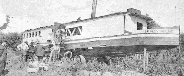 On truck wheels to Souris River, Maiden Voyage, 1909.