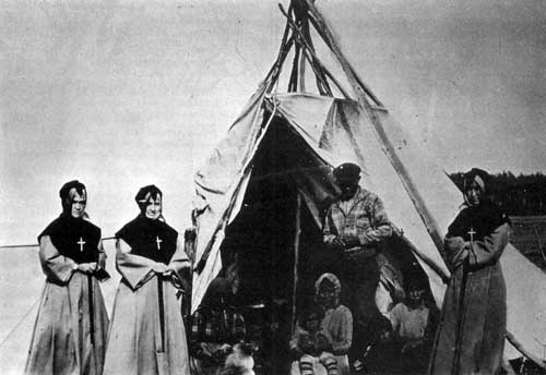 Visiting Indian Teepees at Fort Providence, Northwest Territories, circa 1930