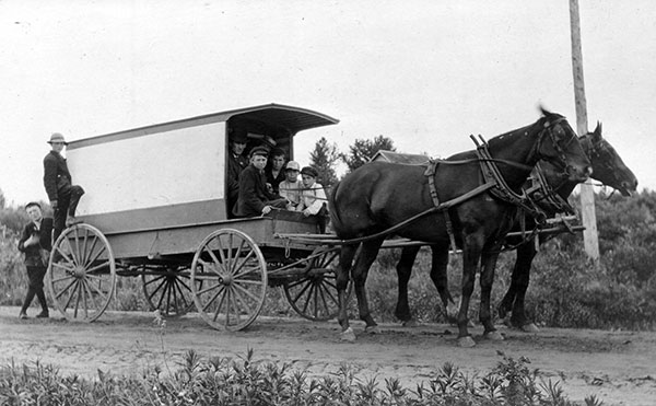 The school van. As consolidation through the 20th century gathered students from increasingly large catchment areas, it became necessary to organize formal shuttle services to get them to school. This horse-drawn example, from the Gilbert Plains area circa 1911, was typical of the time when Starbuck Consolidated School was established.