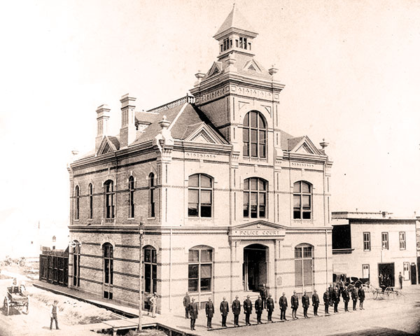 Members of Winnipeg’s new police force stand in front of the Police Court on James Street, 1886.