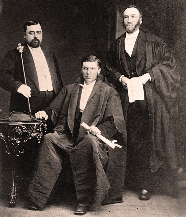 Officers of the Legislative Council, shown here in a photograph from 1876, included (L-R): Victor Beaupre (Usher of the Black Rod, who summoned council members to the legislative chamber), Colin Inkster (Speaker), and Thomas Spence (Clerk).