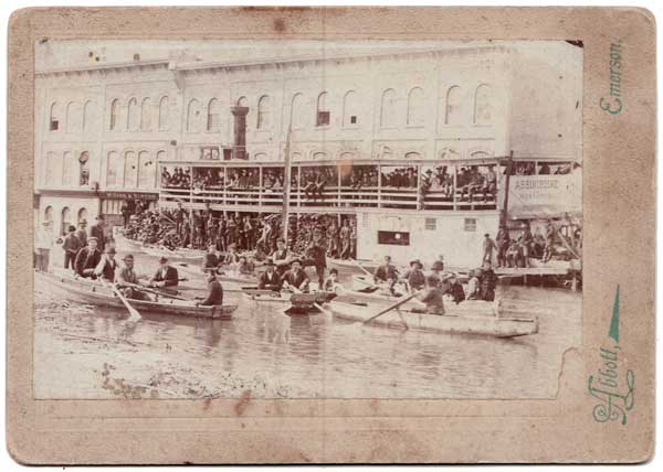 Abbott photographed the steamboat Assiniboine on the streets of Emerson during a catastrophic flood in 1897. For more information, see Steamboats to the Rescue, 1897.
