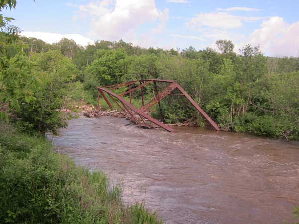 Through truss bridge on the Shell River at Asessippi, built in 1893 and partially dismantled in 1969