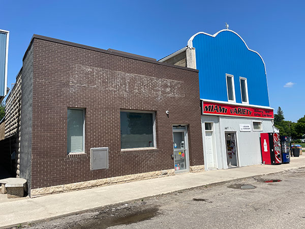The former Canadian Bank of Commerce Building at left and the Westaway Pharmacy Building at right