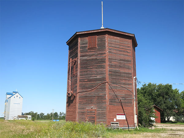 Clearwater railway water tower with grain elevator in the background