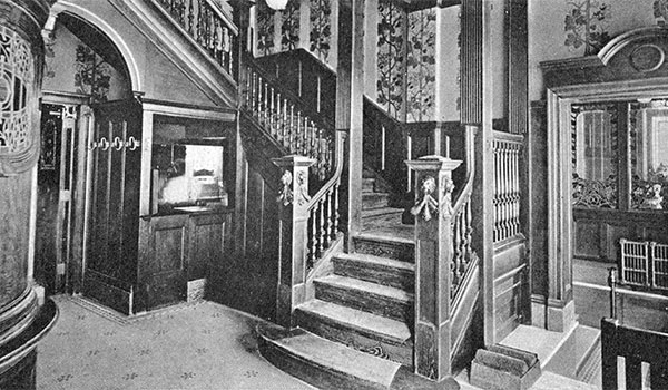 Postcard view of front hallway and staircase in the Cox House