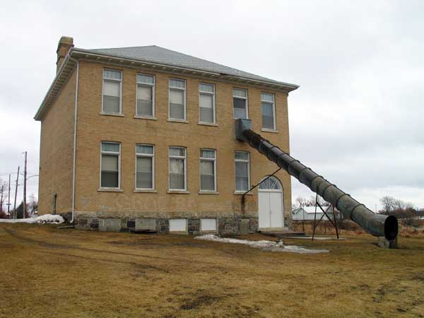 The rear of the Darlingford School building, showing its unique fire escape