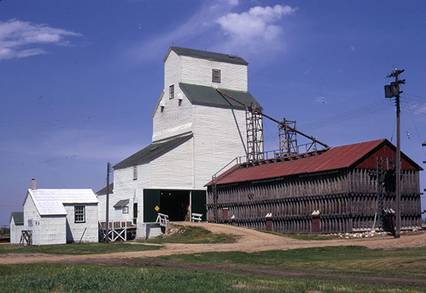 The former Manitoba Pool grain elevator at Dutton Siding after it was traded to United Grain Growers and repainted