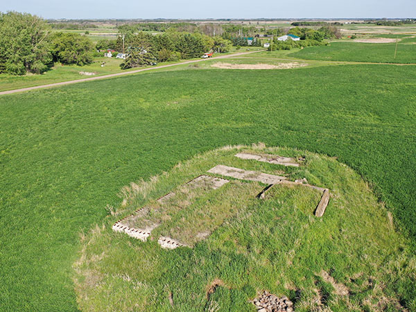 Aerial view of the concrete foundation for the former Manitoba Pool grain elevator at Ebor