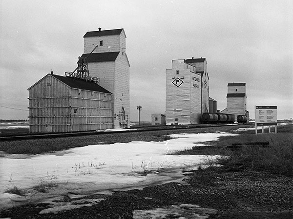 The grain elevators of Fairfax with United Grain Growers at left, Paterson in centre, and Manitoba Pool at right