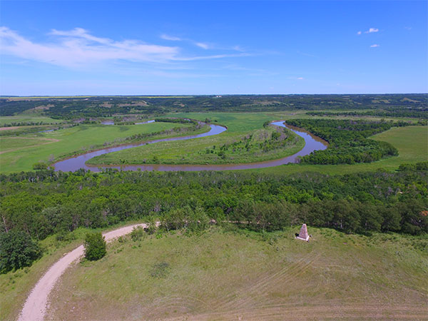 Aerial view of the Fort Ellice site, including monument, with the meandering Assiniboine River in the background