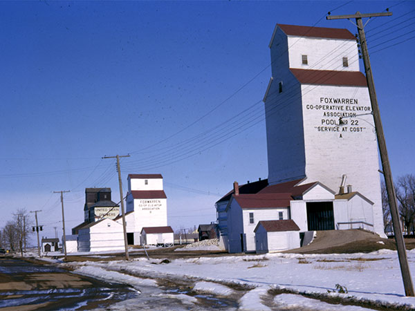 Manitoba Pool grain elevator “A” in foreground with “B” and United Grain Growers elevators in background, at Foxwarren