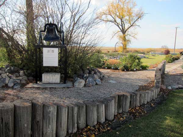 Foxwarren School commemorative monument with bell and cornerstone