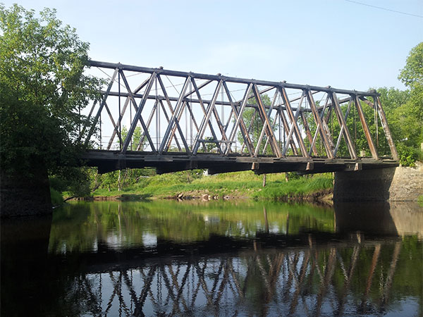 Wooden through truss bridge over the Roseau River