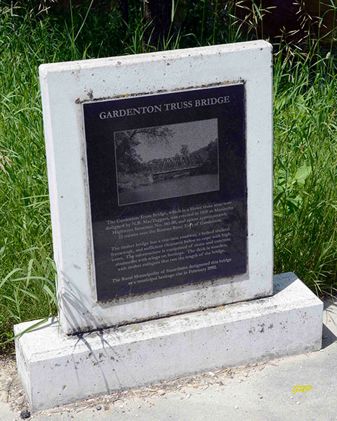 Wooden through truss bridge commemorative monument