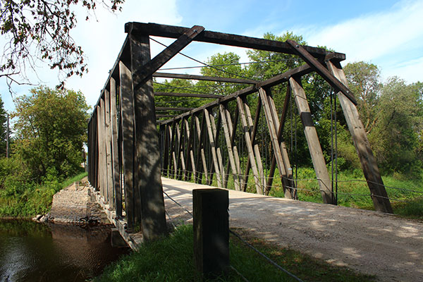 Wooden through truss bridge over the Roseau River