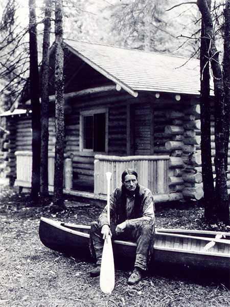 Archie Belaney at his cabin in Riding Mountain National Park