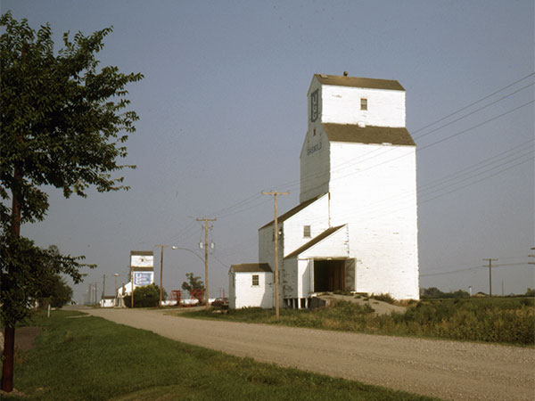 The former United Grain Growers grain elevator 2 at Griswold with the 1 elevator in the background