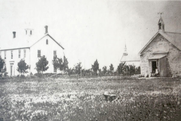 Manitoba College 1871-1874 at left, Kildonan Church in background, and Kildonan West School at right