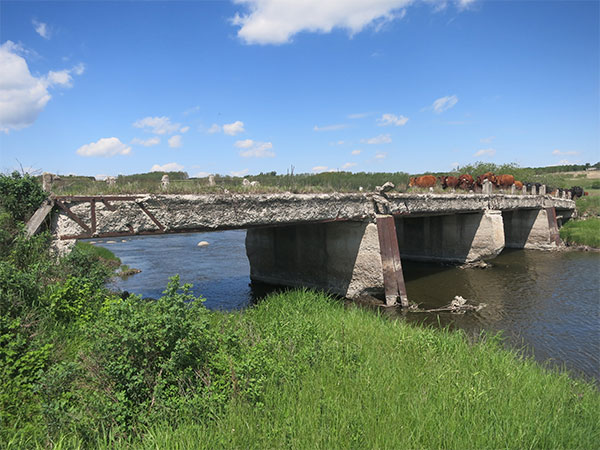 Abandoned concrete beam bridge over the Little Saskatchewan River