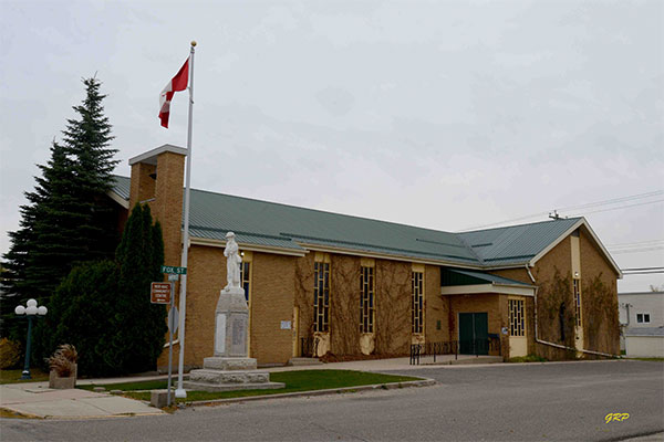 MacGregor United Church with the war memorial in the foreground