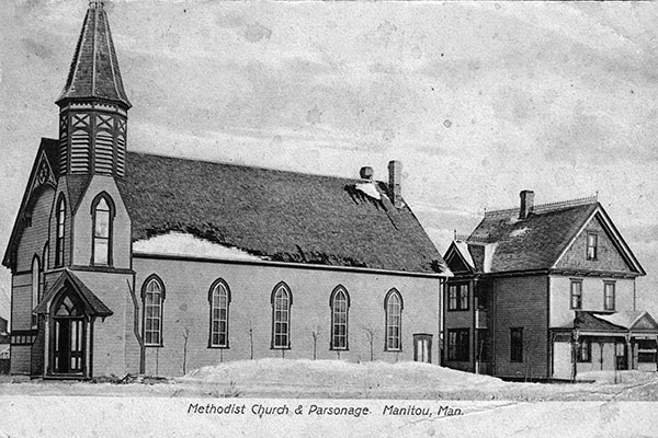 Postcard view of the Manitou Methodist Church and Manse
