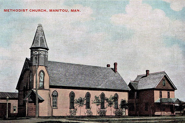 Postcard view of the Manitou Methodist Church and Manse