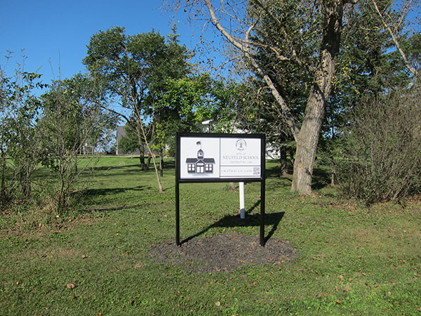 Neufeld School commemorative sign