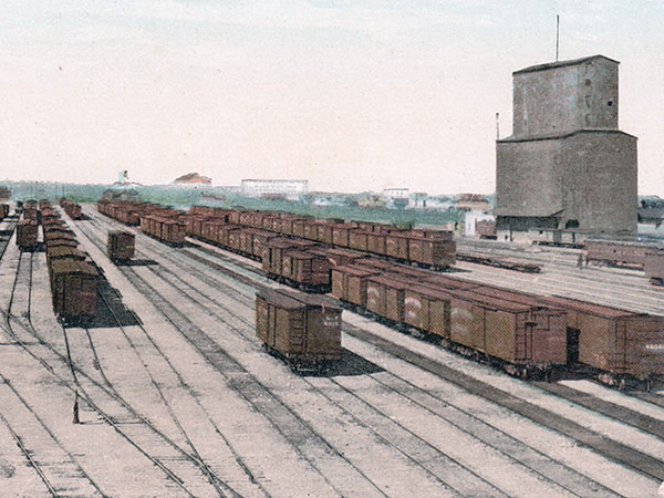 Postcard view of CPR yard and Northern Grain elevator at right