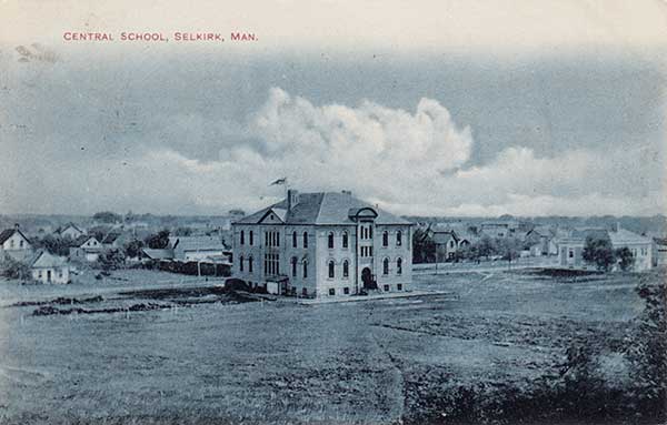 Postcard view of the Selkirk Central School, with the public library in the right background