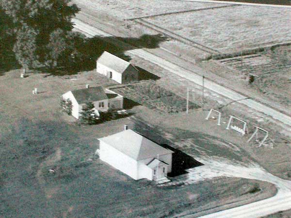 Aerial view of the Silberfeld School site, with the associated teacherage, garden, and barn