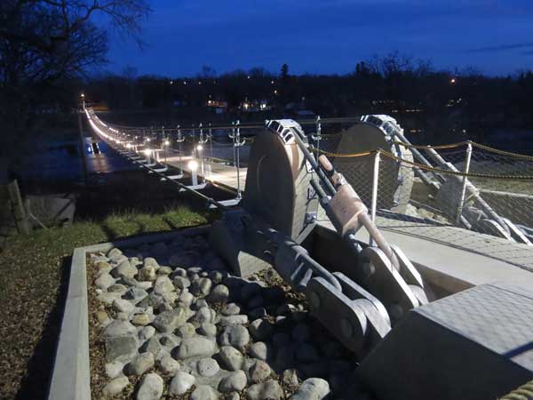 The illuminated Souris Suspension Bridge that replaced one destroyed in a 2011 flood