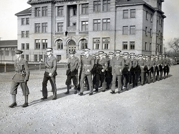 Members of the University of Manitoba's contingent Officers' Training Corps (COTC) on the Broadway campus during Armistice Day