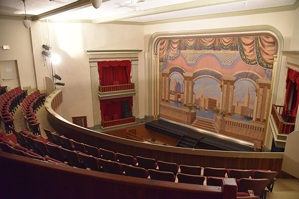 View of the stage and decorated curtain in the Virden Auditorium