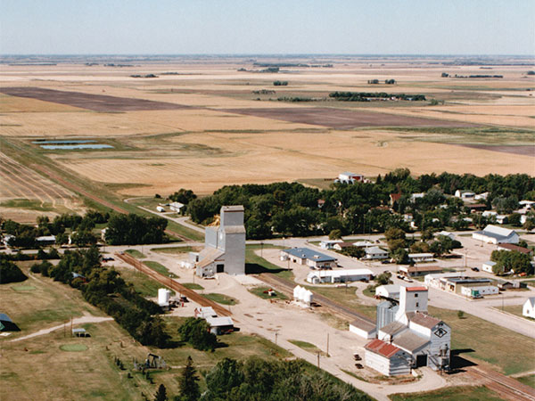 Aerial view of the grain elevators at Waskada with the Paterson Grain elevator and annexes in the foreground