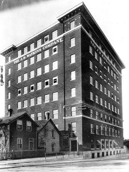 J. R. Watkins Company Building prior to demolition of residences to the south