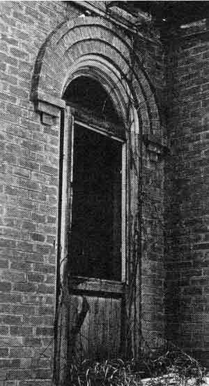 Romanesque arch frames the fanlite that once held ruby glass from&nbsp;France.