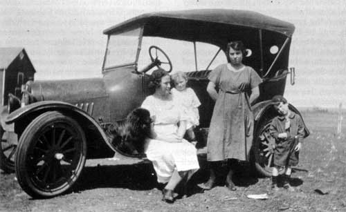 Women and children with early&nbsp;Chevrolet automobile near Morden