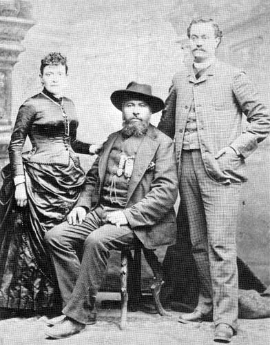 Gabriel Dumont the statesman with his &ldquo;writer&rdquo;, E. Riboulet and Mrs. Riboulet&nbsp;(not Madeleine Dumont as sometimes identified), Staten Island,&nbsp;N.Y., 1887.