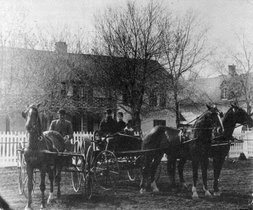 The McKay home at &lsquo;Deer Lodge.&rsquo; James McKay is seated centre holding the whip.