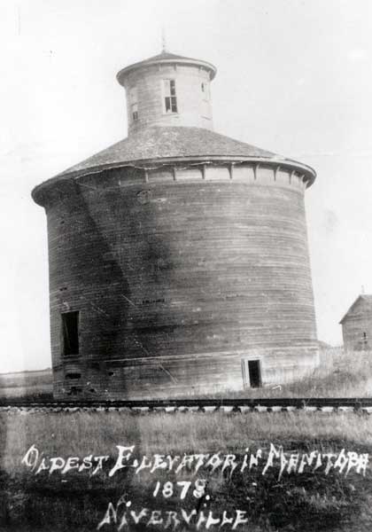 Niverville&rsquo;s unique circular elevator, the first built in Manitoba, in 1878. Mennonites brought to Manitoba by William Hespeler reached Niverville in September 1874