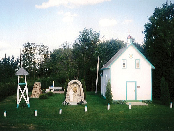 Photo of St. Michael&rsquo;s Ukrainian Catholic Church, grotto and bell tower at the Trembowla Cross of Freedom site.