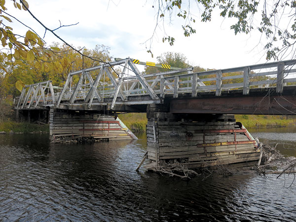 A derelict wooden bridge over the Whitemouth River, built by Winnipeg&rsquo;s Reidle Brewery, is now closed to all traffic.