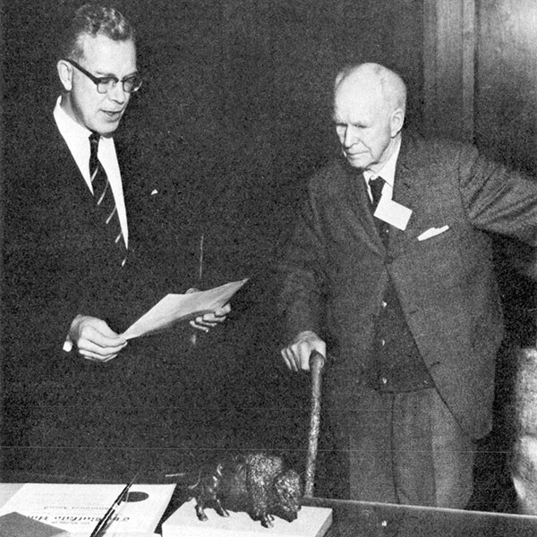 Dr. F. L. Skinner being awarded the Order of the Buffalo Hunt by Premier Duff Roblin