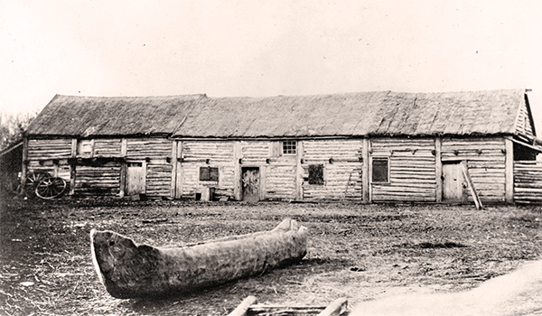 The Red River Settlement was in transition between the Pioneer and Commercial Eras when photographer Humphrey Lloyd Hime
visited in the fall of 1858 as a member of the Hind Exedition from Canada. Wood was the dominant material used for construction of
buildings, as seen in this view of Andrew McDermot’s store near Upper Fort Garry.