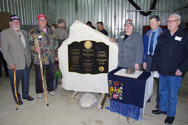 Veterans unveil monument. Left to right: Arnold Sinclair, Drank Orvis, Randi Gage, Thomas Whitburn, and Gerald Bennett in Riverton, Manitoba at the unveiling of the new memorial stone, 14 May 2016.