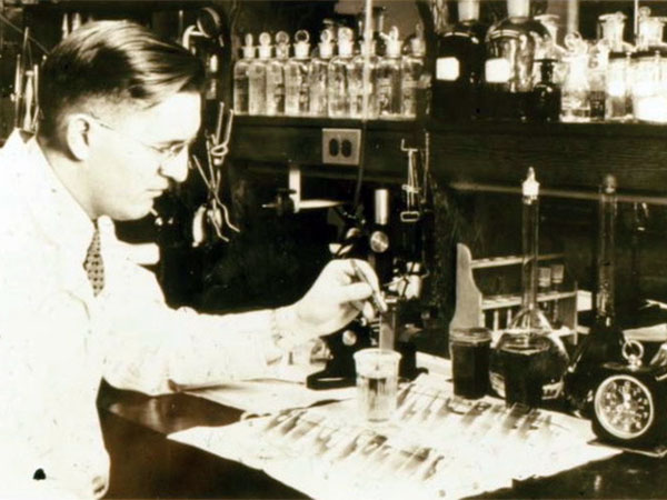 W. M. Ward doing a chemical test