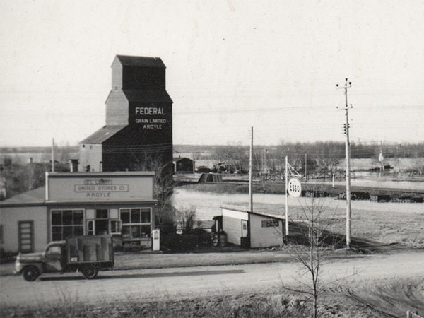 Argyle General Store and the Federal Grain elevator, as seen from a window in the Brant Consolidated School