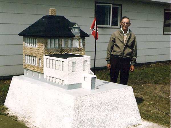 John Seaman with his newly-built model of Austin School