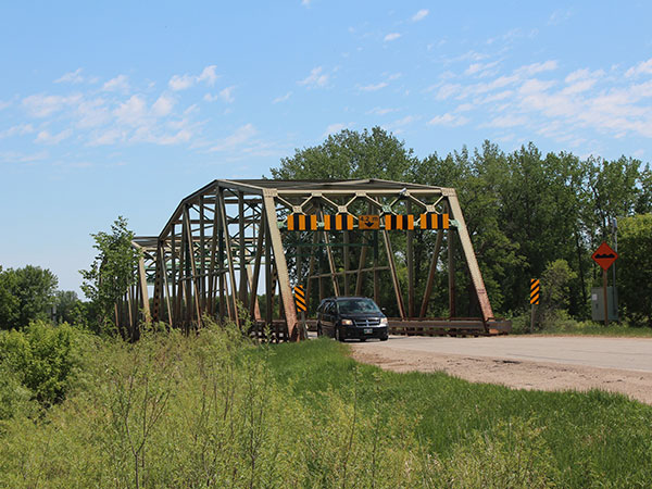 Steel through truss bridge over the Assiniboine River at Baie St. Paul